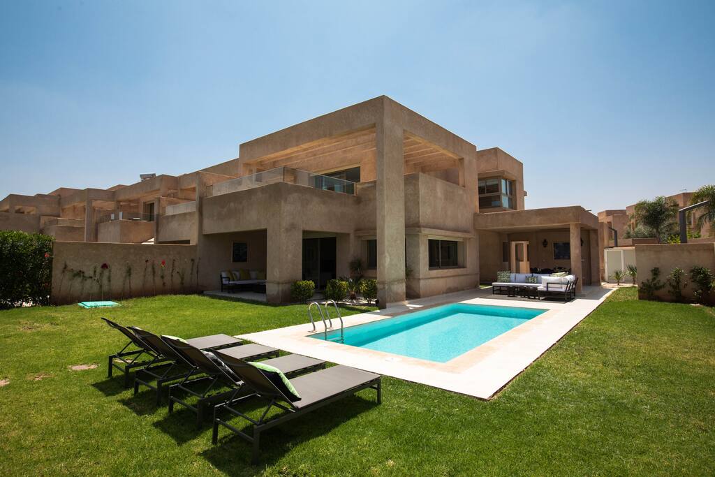 View of the house while laying down on the sun beds.