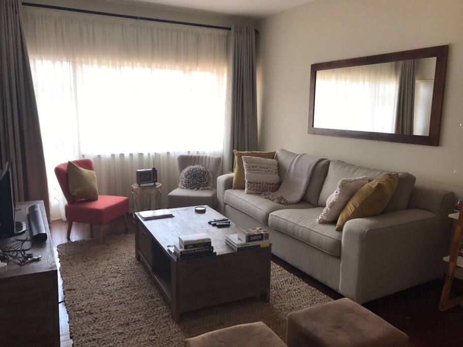 Living room with sound system, satellite connection and TV.