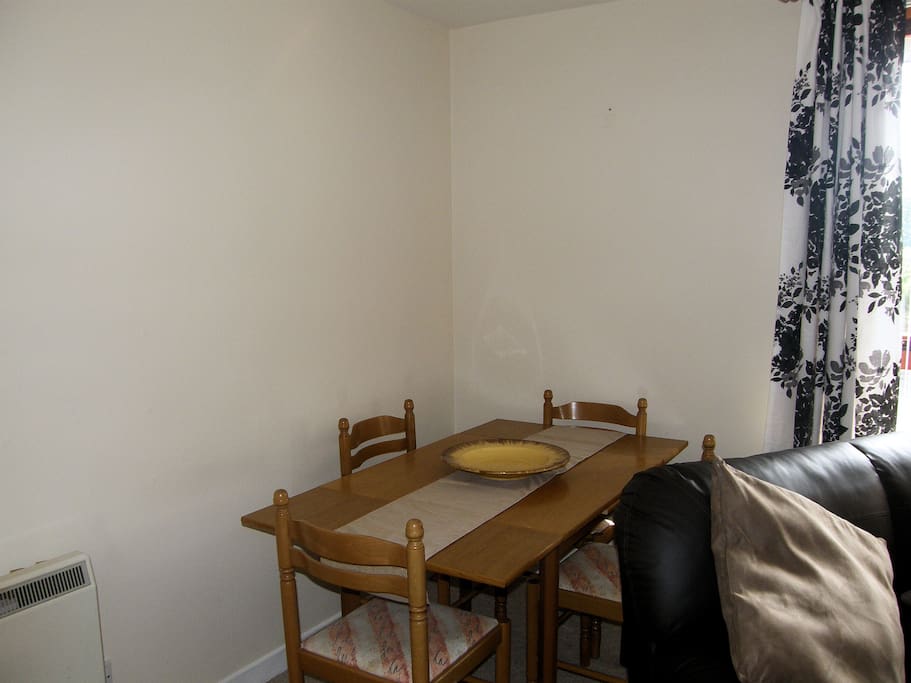 There is a table in the lounge area seating for 4 to 6 and another in the kitchen giving plenty of space for eating.