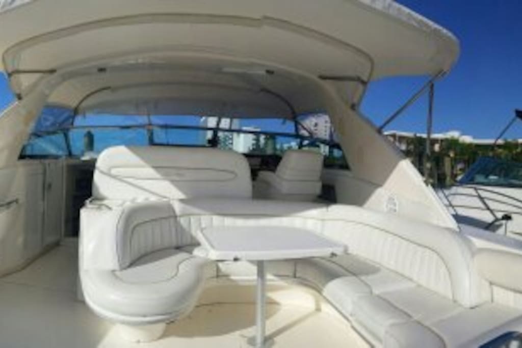 Large rear lounge w/shower, bar, fridge, sink, BBQ grill
