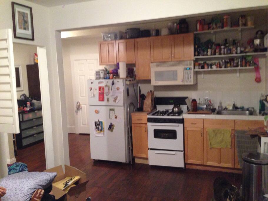 Fully stocked Kitchen , and a bit of the foyer *clearly we are not professional photographers*