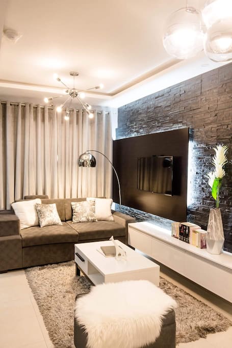 Living room with natural stones wall cladding