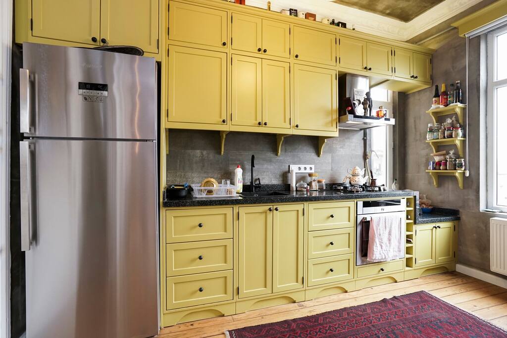 Custom-made kitchen and energy-saving fridge and oven with gas cooking