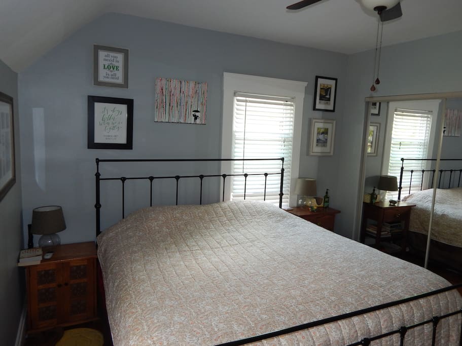 Spacious master bedroom with king sized bed and walkout balcony