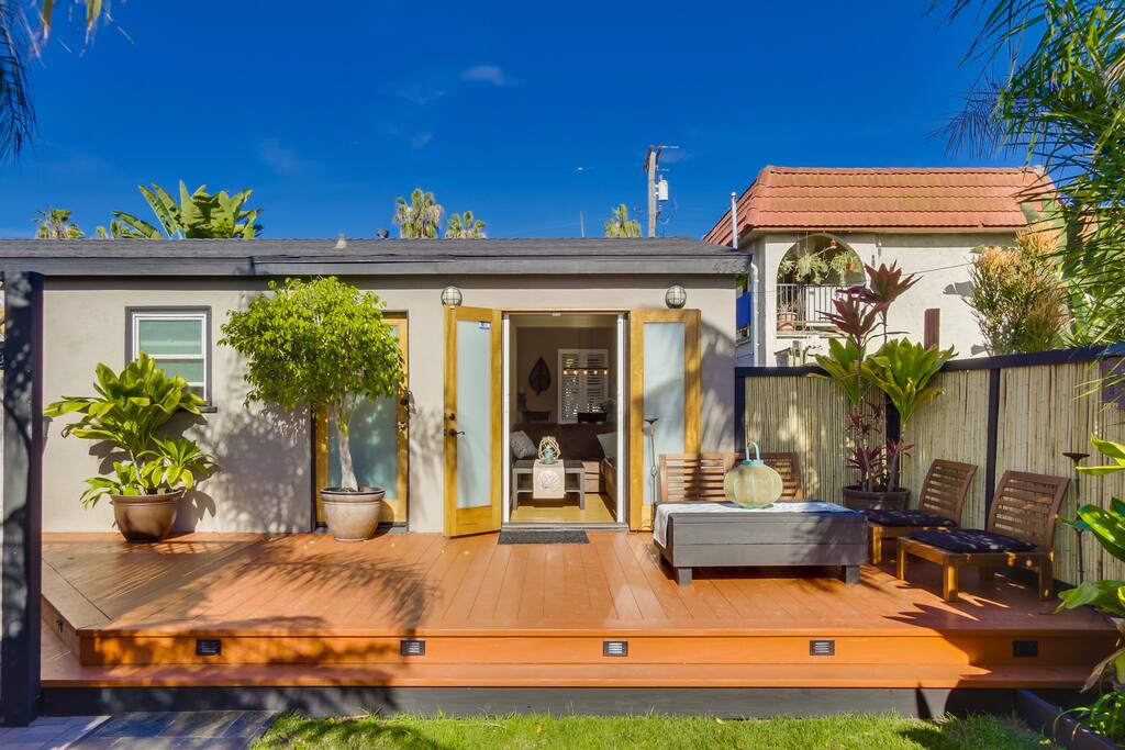 Sunny seating area on front deck. Indoor/ outdoor living.