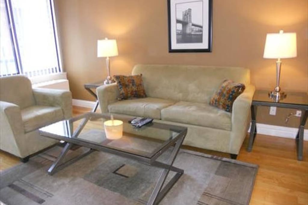 Our spacious Living Room offers a pull out sofa bed and windows which offer a lovely view.