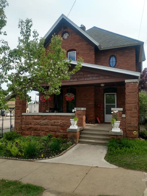 Your Front Entrance with Gardens and Porch Swing