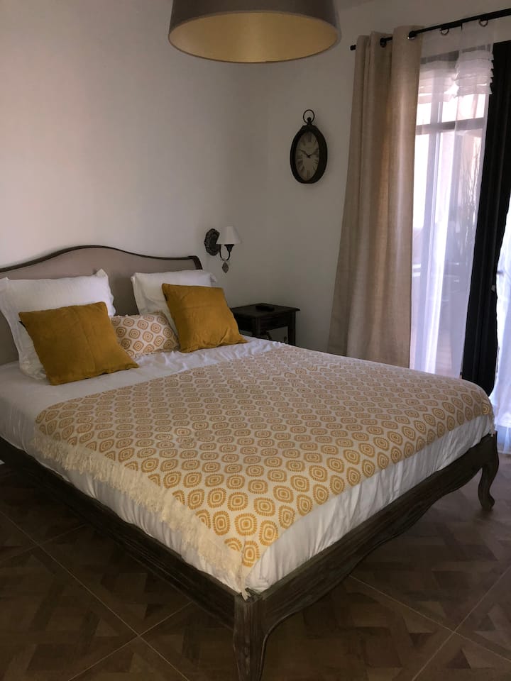 Bedroom 1: cozy, new premium 160 bedding, opening onto terrace and swimming pool. Wardrobe with hangers, wall TV, heating, double curtains and shutters and bathroom with walk-in shower and private toilet