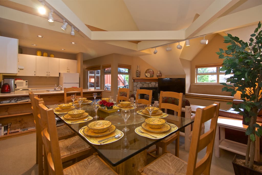 The great room: living, dining and kitchen. Note the vaulted ceiling over the living and dining areas. This is a large and welcoming space for friends and family to gather.