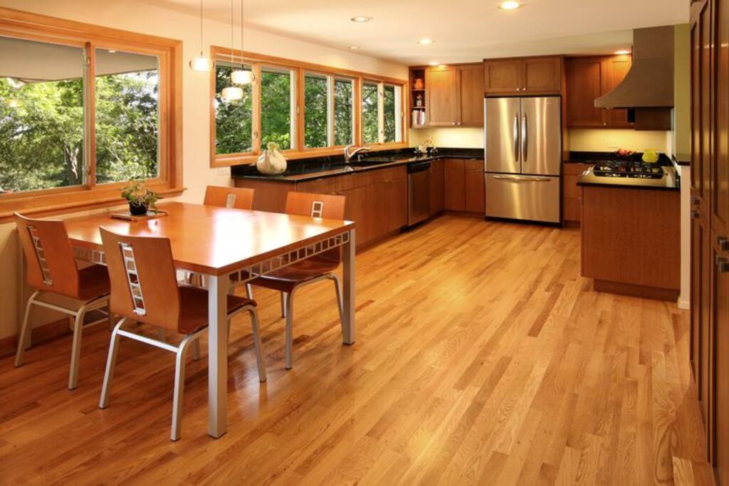 Eat in kitchen with gas range is full of light