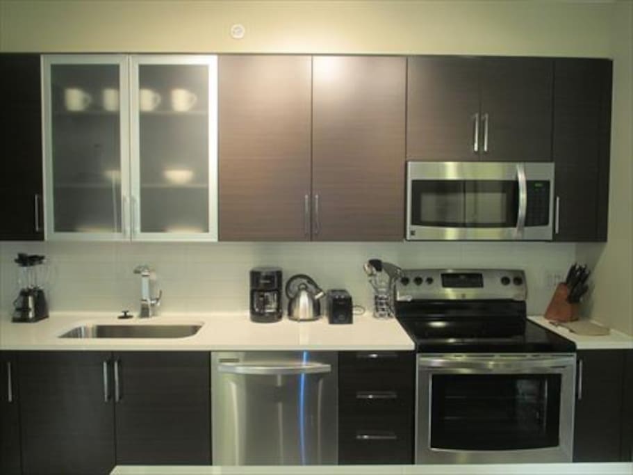 Fully equipped kitchen with full size appliances, pots, pans and dishes