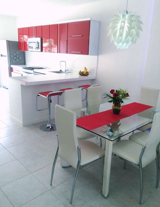 Fully equipped gourmet kitchen: gas stove/oven, microwave, dishwasher and potable water dispenser