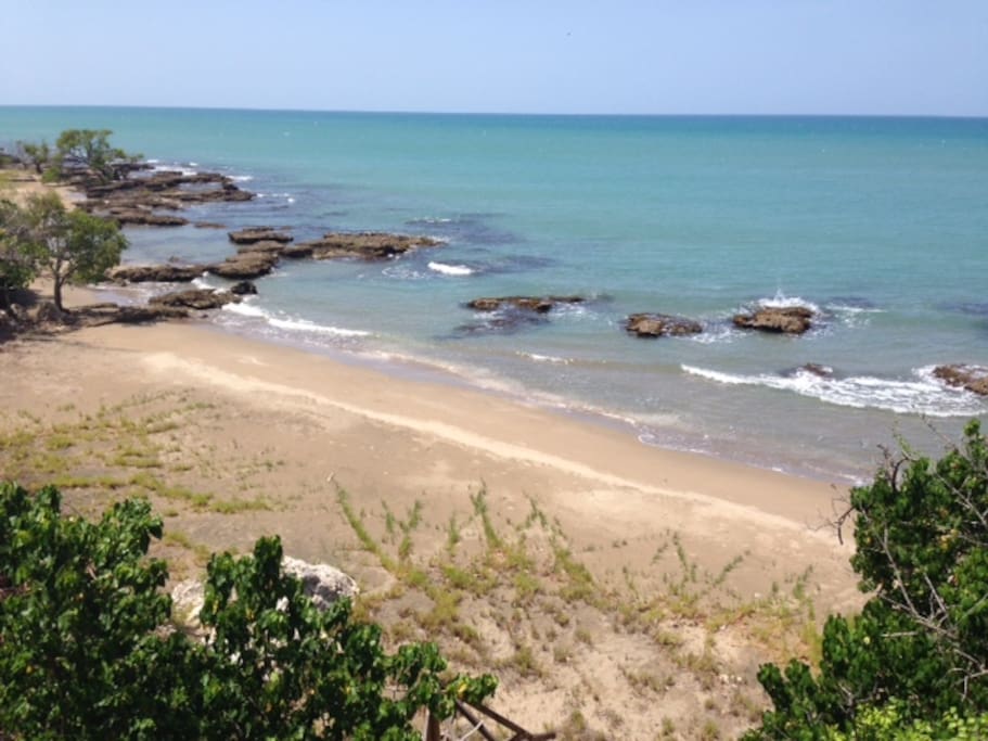 Beach. 300 ft from the pool area. A safe beach in terms of rip tides and strong currents. Mostly a sandy bottom and great swimming just beyond the rocks or wadding closer in.