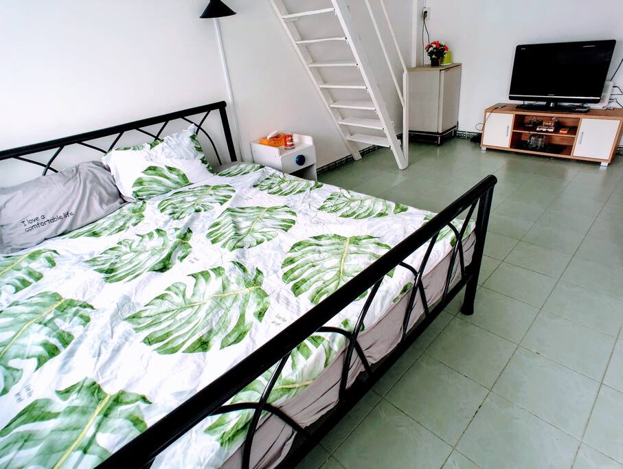 That is a King Bed, a very large one to ensure your "Kingdom" of your sleep, or just watching some movie from the TV over there.