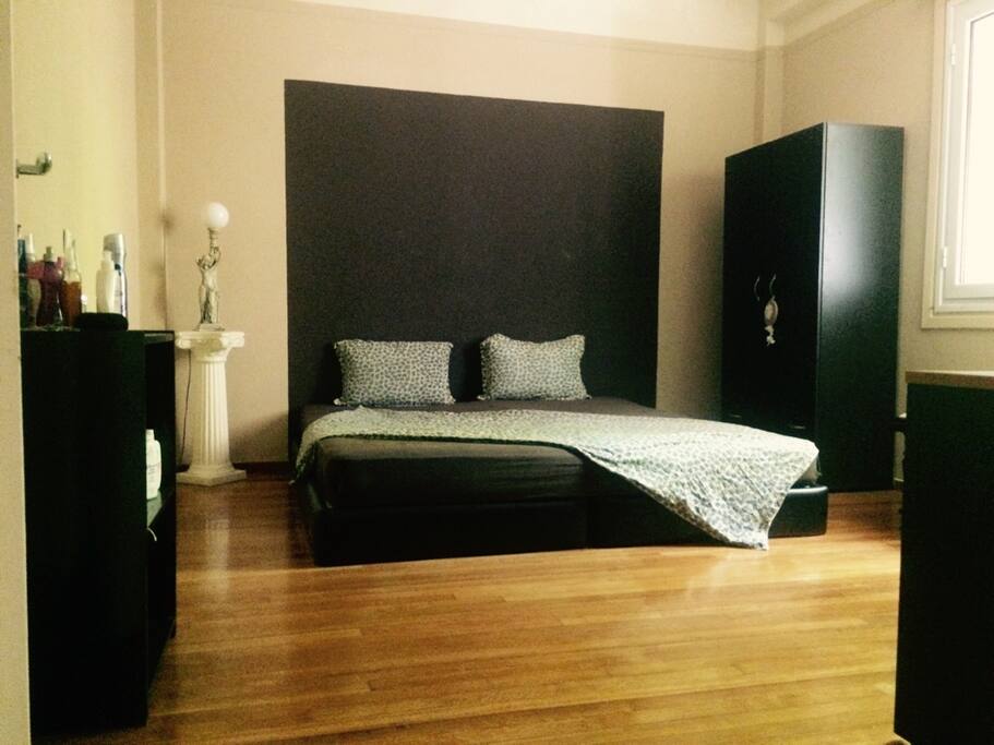 Double bed room with wardrobe, and study desk.