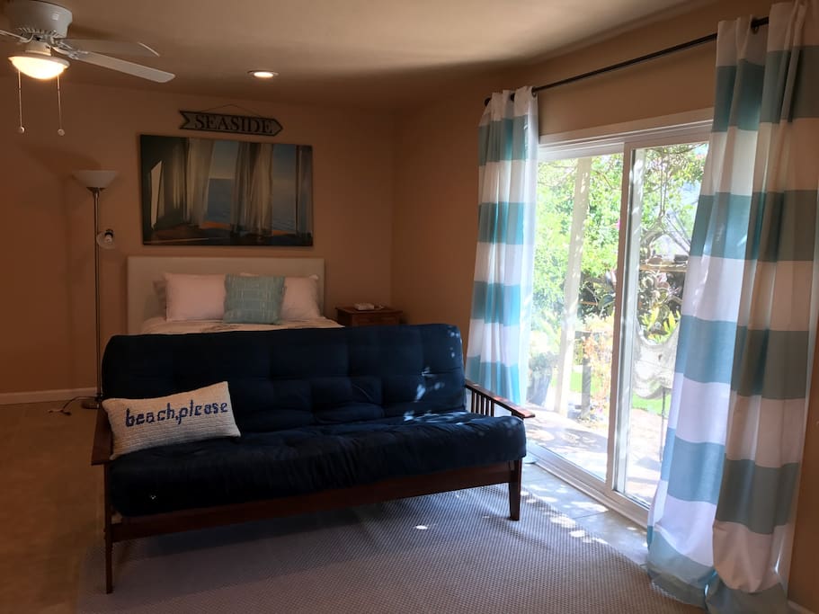 Comfy futon couch that fold out to a double bed and a queen size bed.