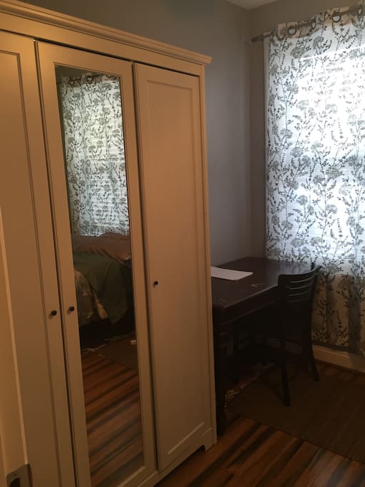 The guest room includes a full size bed and bedding/towels, closet and wardrobe, desk and chair with lots of natural light.