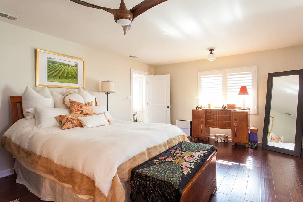 Tastefully decorated Master bedroom suite. Bedroom door locks. Decorative ceiling fan.