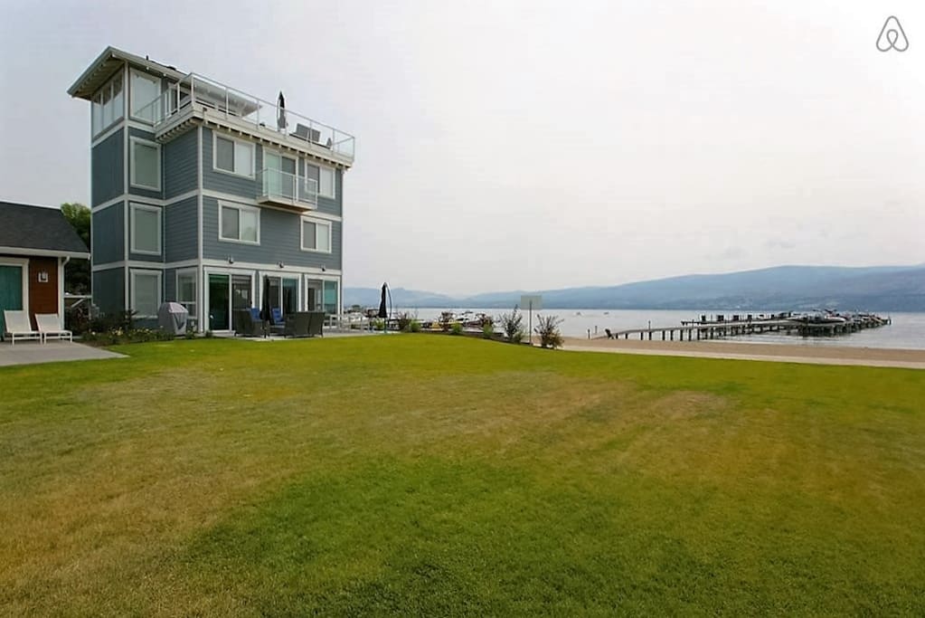 Large grass play area meets the 35o ft. of sandy beach. Just outside your door.