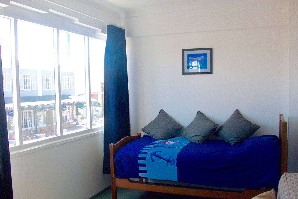 SINGLE BED IN FRONT ROOM