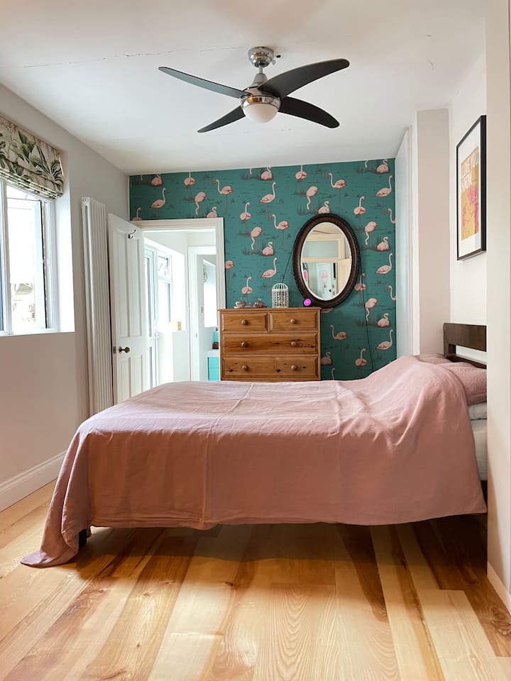 Bedroom 1 -  Spacious and bright with solid wood floors, king size bed and blackout blinds