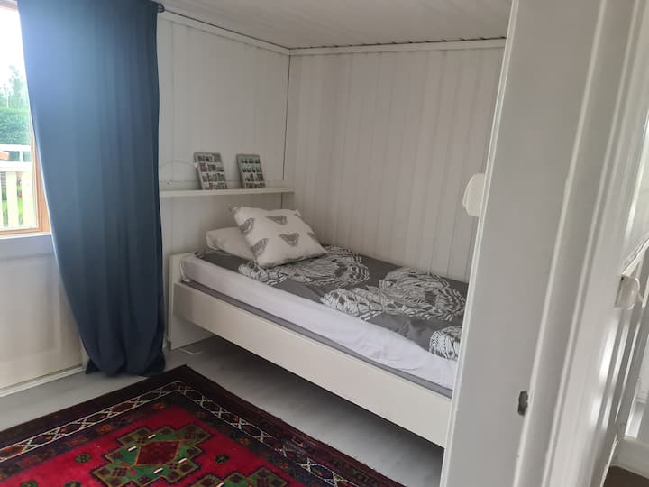 Bedroom 3 upstairs with 2 separate beds and exit to the balcony with cafe table and 2 chairs.