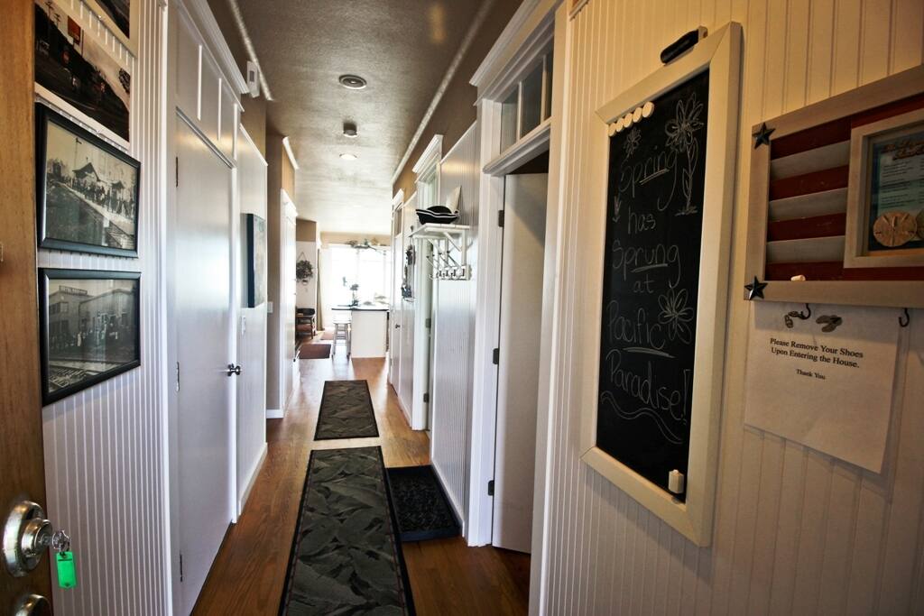 Entry hall leading to living area and half bathroom