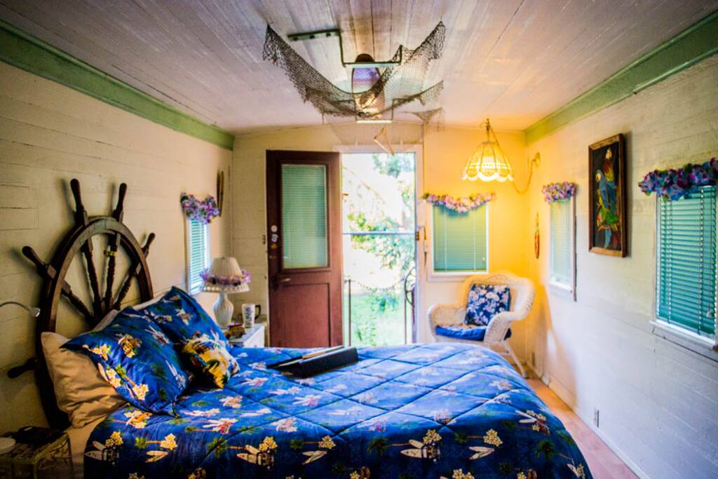 Your own cozy caboose nestled in a meadow.