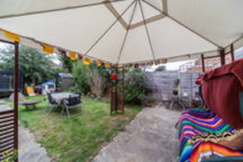 Relax under the gazebo, in a lovely garden.