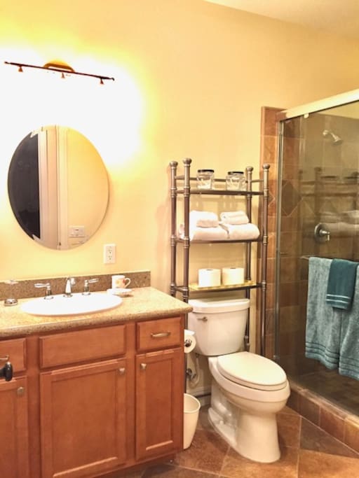 Nicely appointed Bathroom is clean and has towels and essentials.