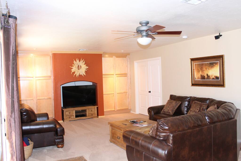 Family Room with 55" TV Cable Television Blu-Ray Player Surround Sound & Ceiling Fan