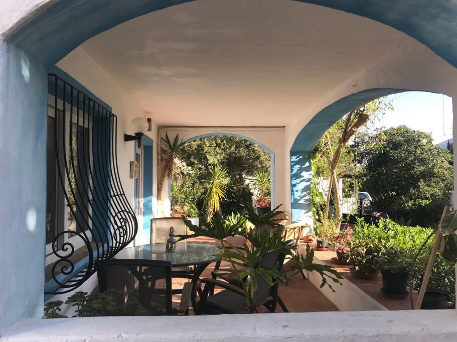 Porch seating area. Perfect for al fresco shaded lunch