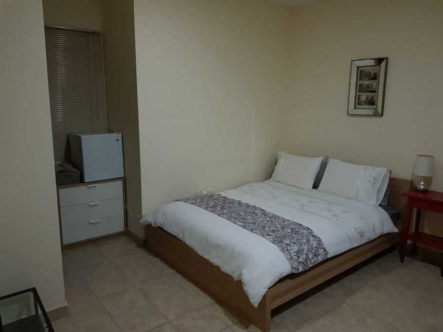 Double bed, fresh linen and towels, plus room cleaned for guests staying longer than two weeks.