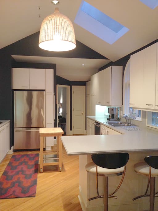 Spacious, well-stocked kitchen with modern appliances