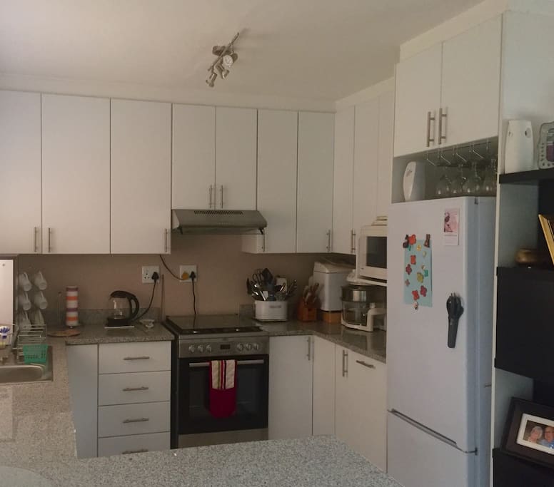 Open planned kitchen with dishwasher, gas stove and all kitchen amenities