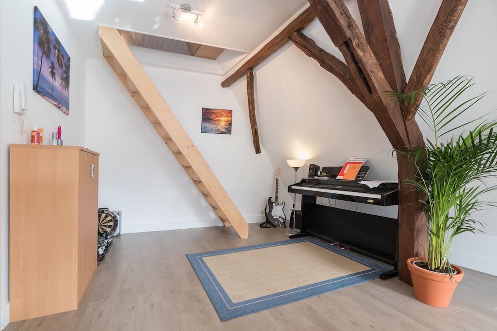 Other side of the living room with the stairs to my private bedroom