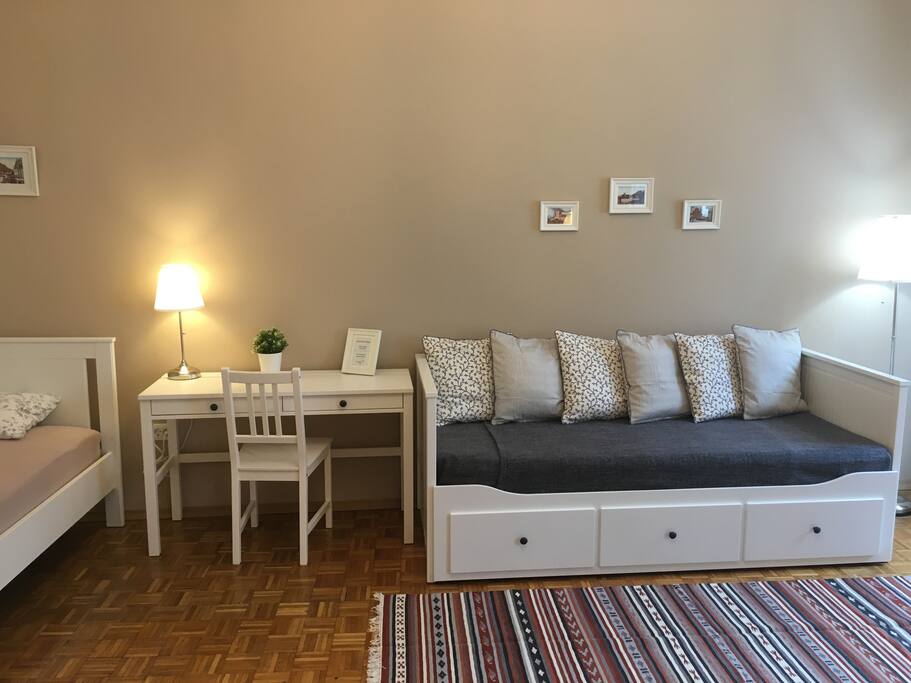 Spacious bedroom with king size double bed, one single bed and bed sofa