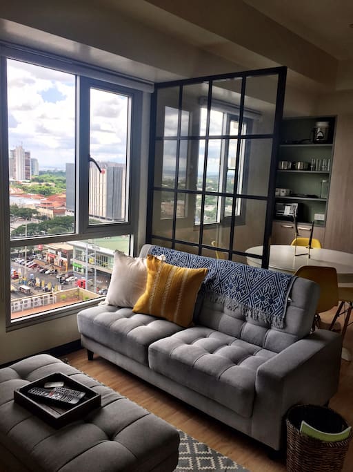 Living room and view of commercial center across the street