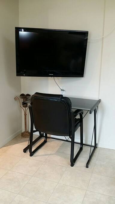 A small desk with a comfortable chair!