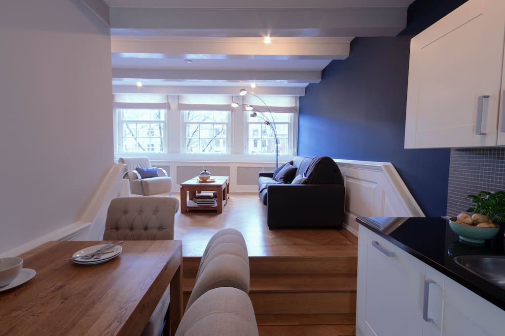The lovely kitchen, living room and newest sofa bed