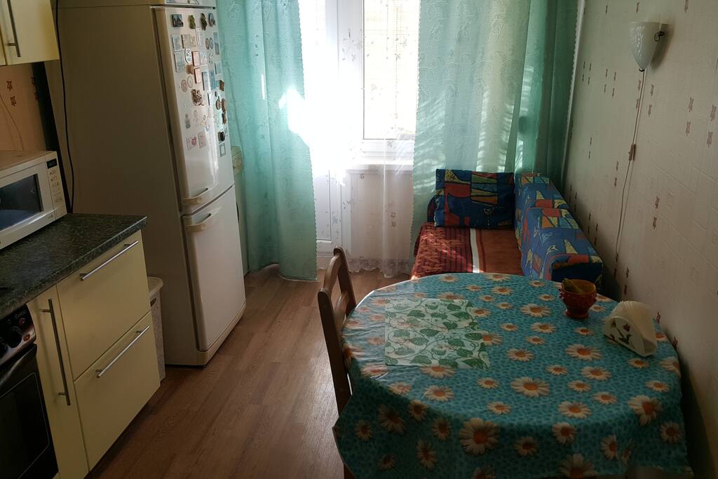 A kitchen and second sofa