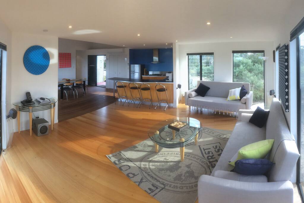 Lounge with comfy new sofas and TV & media system (if you can take your eyes off the view).