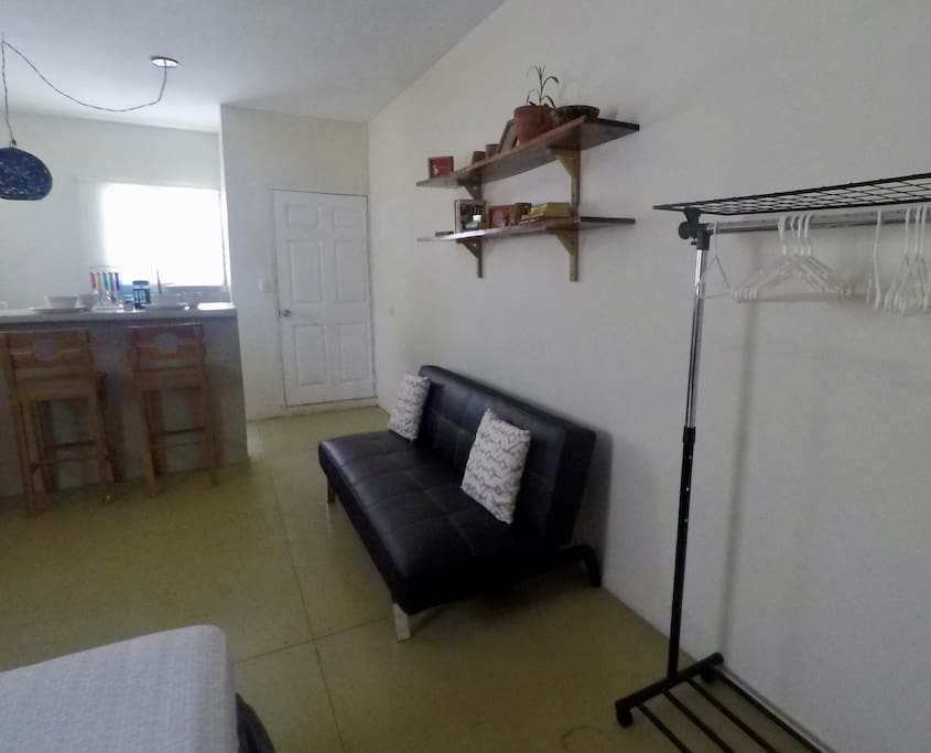 Full equipped for living including a wardrobe rack and a fold down sofa for extra sleeping space. "The apartment was such a nice getaway for the week in SJDS. It has everything you need" Shevonne