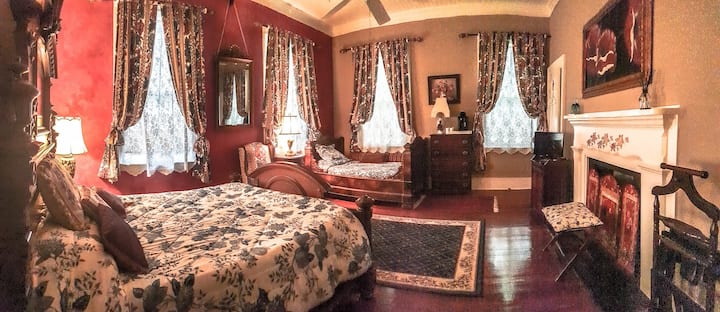 The Red Room is furnished with an antique queen bed and a 3/4 size French antique day bed. Private bath is ensuite and  includes a sink/commode and separate large shower room. 