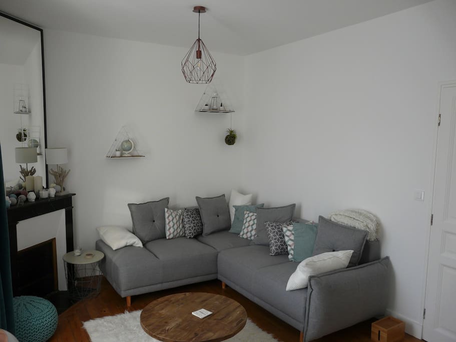 living room with sofa bed and fireplace