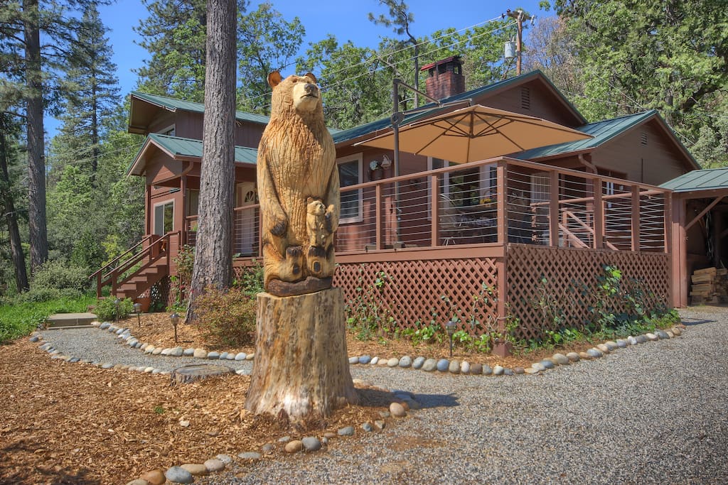 Carved bear by 1,600 square foot cabin welcomes you home as you arrive!