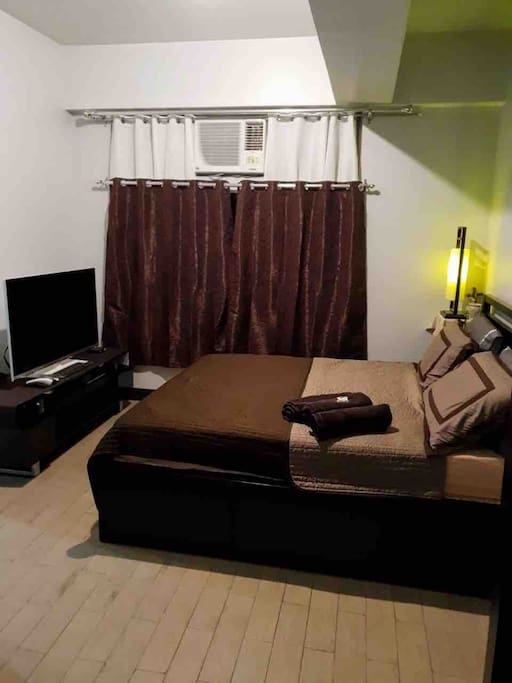 Queen size bed and 47” Smart TV