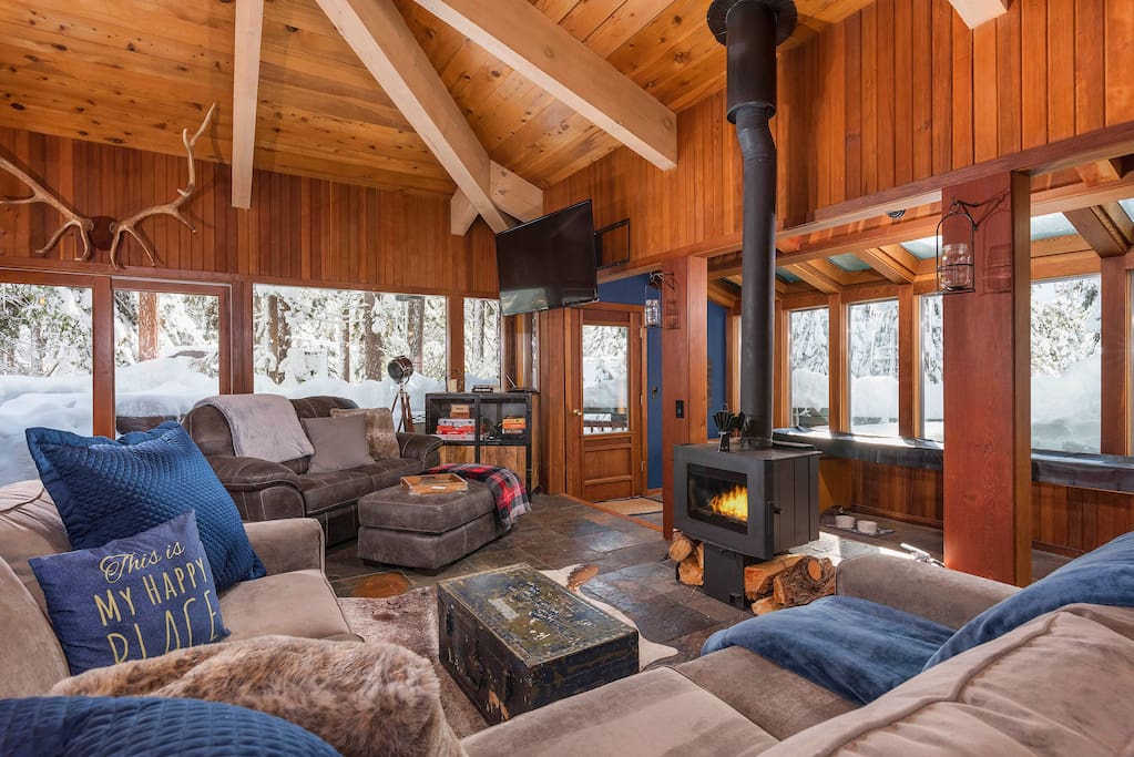 As you step inside, you’ll enter an open-concept living space with a classic mountain lodge feel