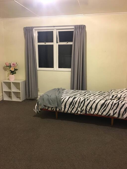 One Bedroom with single bed and wardrobe.