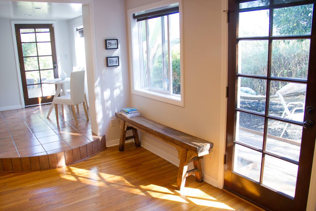 Bright morning sunlight floods living room.